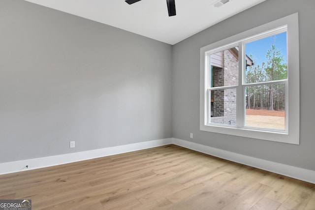 194 Forest Berry Ct Unit 98M2, Newnan, GA 30265 - unfurnished room featuring plenty of natural light, light wood-style floors, and ceiling fan