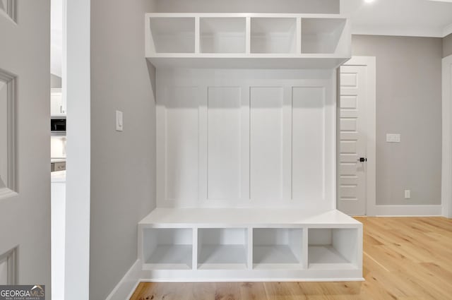 194 Forest Berry Ct Unit 98M2, Newnan, GA 30265 - mudroom with light wood-style floors and crown molding