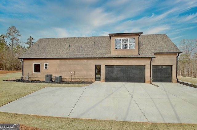 194 Forest Berry Ct Unit 98M2, Newnan, GA 30265 - rear view of property with driveway, an attached garage, a yard, and a shingled roof