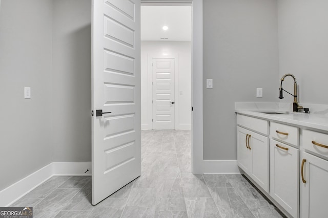 194 Forest Berry Ct Unit 98M2, Newnan, GA 30265 - laundry room featuring a sink and baseboards