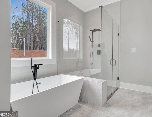 194 Forest Berry Ct Unit 98M2, Newnan, GA 30265 - full bathroom with a shower stall, a freestanding tub, and marble finish flooring