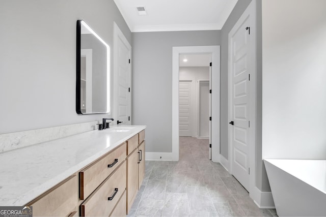 194 Forest Berry Ct Unit 98M2, Newnan, GA 30265 - bathroom featuring a freestanding tub, vanity, ornamental molding, and a closet