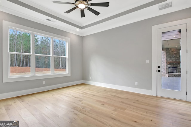 194 Forest Berry Ct Unit 98M2, Newnan, GA 30265 - spare room featuring ceiling fan, light wood-type flooring, and a raised ceiling