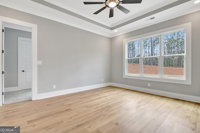194 Forest Berry Ct Unit 98M2, Newnan, GA 30265 - unfurnished room with ceiling fan, light wood finished floors, a tray ceiling, recessed lighting, and crown molding