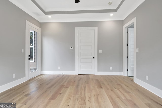 194 Forest Berry Ct Unit 98M2, Newnan, GA 30265 - empty room featuring a raised ceiling, crown molding, light wood-style floors, and recessed lighting