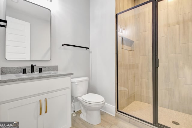 194 Forest Berry Ct Unit 98M2, Newnan, GA 30265 - bathroom with a stall shower, vanity, and wood finished floors