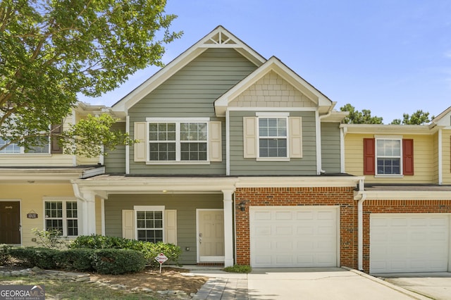 2203 Hyssop Way, Buford, GA 30519 - townhome / multi-family property featuring an attached garage, driveway, and brick siding