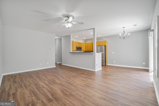 2203 Hyssop Way, Buford, GA 30519 - unfurnished living room with a chandelier, ceiling fan, wood finished floors, and recessed lighting