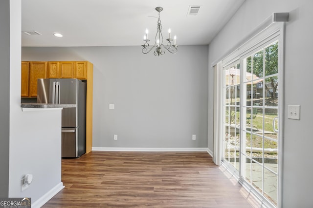 2203 Hyssop Way, Buford, GA 30519 - unfurnished dining area with a chandelier, wood finished floors, and recessed lighting
