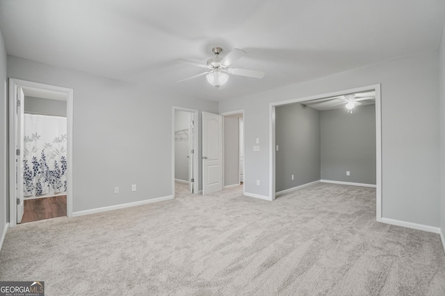 2203 Hyssop Way, Buford, GA 30519 - unfurnished bedroom featuring a spacious closet, carpet floors, ensuite bathroom, and a closet
