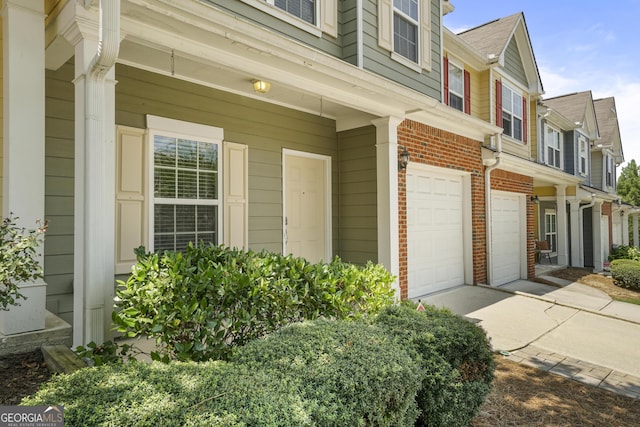 2203 Hyssop Way, Buford, GA 30519 - entrance to property with a garage, brick siding, and concrete driveway