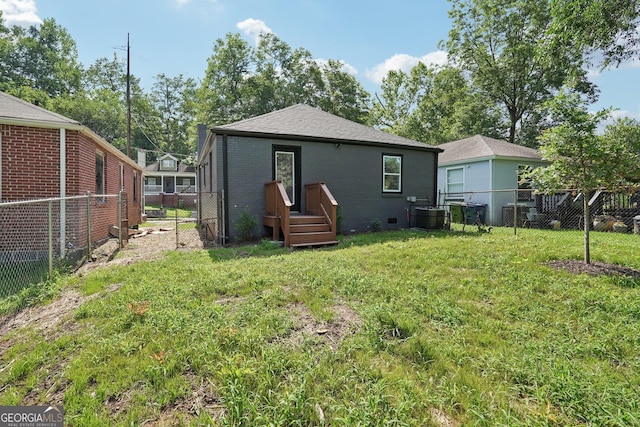 524 Paines Ave NW, Atlanta, GA 30318 - back of property featuring a fenced backyard and brick siding