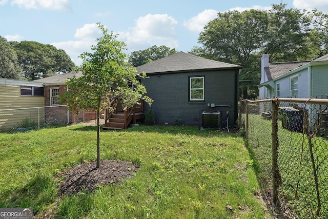 524 Paines Ave NW, Atlanta, GA 30318 - back of property featuring a fenced backyard, brick siding, and a wooden deck