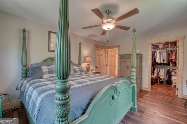 87 Harbin Ct, Morganton, GA 30560 - bedroom featuring wood finished floors, a closet, a walk in closet, and a ceiling fan