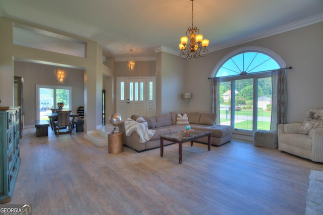 15 Saddlebrook Dr SE, Rome, GA 30161 - living room with a chandelier, wood finished floors, and ornamental molding