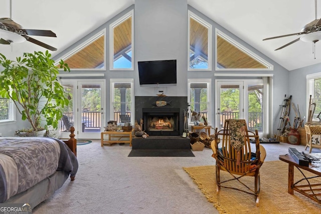1320 Tal Lewis Rd, White Plains, GA 30678 - bedroom with carpet floors, a high end fireplace, access to exterior, high vaulted ceiling, and a ceiling fan