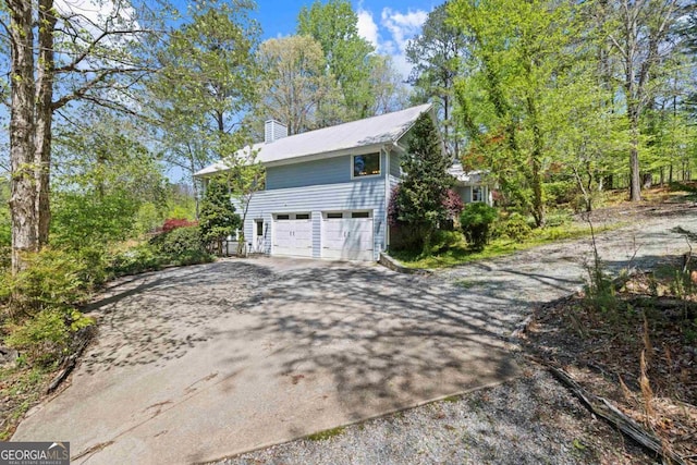 1320 Tal Lewis Rd, White Plains, GA 30678 - garage with driveway