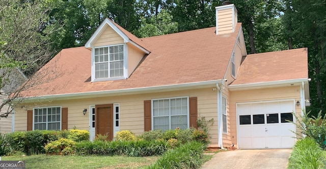 3232 Deer Pause Ln, Decatur, GA 30034 - cape cod house featuring a garage, a chimney, concrete driveway, and a shingled roof
