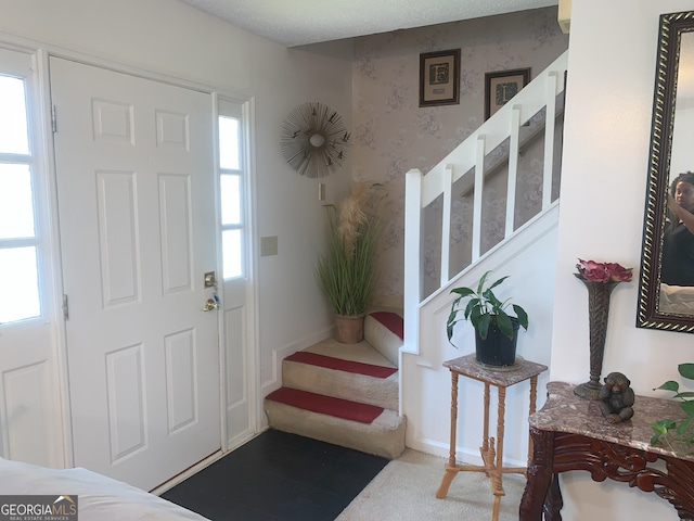 3232 Deer Pause Ln, Decatur, GA 30034 - carpeted entryway featuring stairs and wallpapered walls