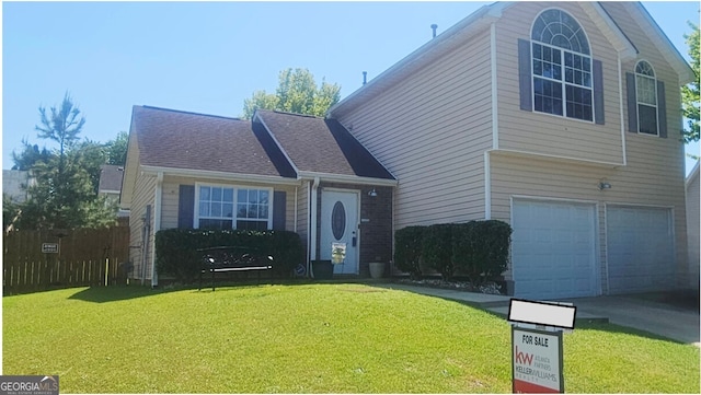 116 Ventura Trl, Stockbridge, GA 30281 - view of front of house featuring an attached garage, a front yard, and driveway