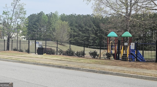 116 Ventura Trl, Stockbridge, GA 30281 - view of asphalt road with sidewalks and curbs