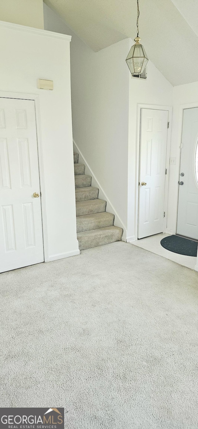 116 Ventura Trl, Stockbridge, GA 30281 - carpeted entryway with lofted ceiling and stairway
