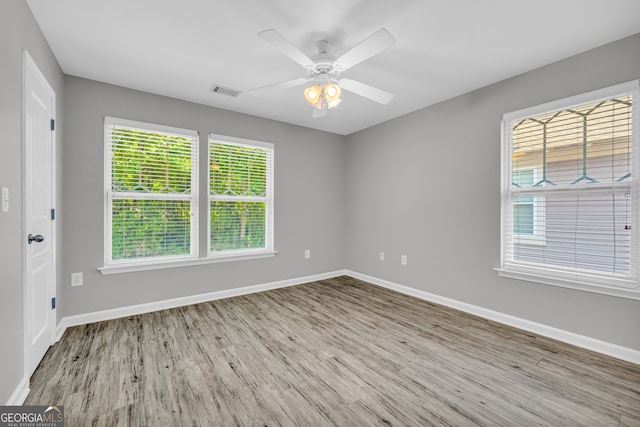 490 Barnett Shoals Rd Unit 528, Athens, GA 30605 - empty room with wood finished floors and ceiling fan