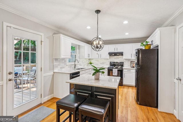 120 Timbervalley Ln, Lawrenceville, GA 30043 - kitchen featuring black appliances, white cabinetry, ornamental molding, under cabinet range hood, and light wood-style flooring