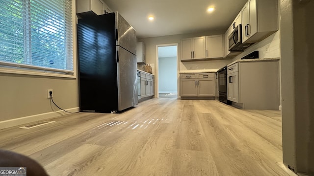 4550 Cypress Ridge Ct, Stone Mountain, GA 30083 - kitchen with appliances with stainless steel finishes, light wood-style floors, light countertops, and recessed lighting