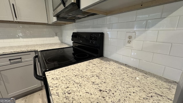 4550 Cypress Ridge Ct, Stone Mountain, GA 30083 - kitchen featuring tasteful backsplash, black range with electric stovetop, gray cabinets, and light stone counters
