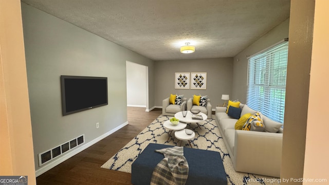 4550 Cypress Ridge Ct, Stone Mountain, GA 30083 - living area featuring wood finished floors and a textured ceiling