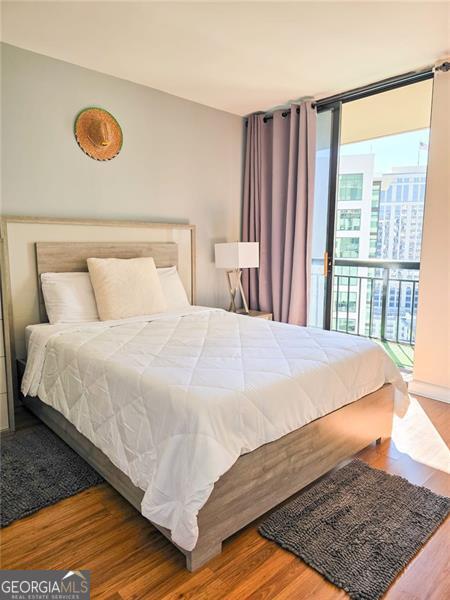 3481 Lakeside Unit 2204, Atlanta, GA 30326 - bedroom with wood finished floors