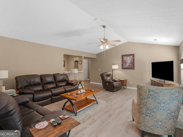 2866 Rosecommons Dr, Hampton, GA 30228 - living area featuring light wood-style floors, a ceiling fan, and lofted ceiling