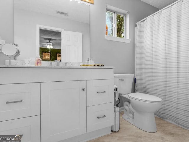 2866 Rosecommons Dr, Hampton, GA 30228 - bathroom with vanity, a ceiling fan, and a shower with shower curtain