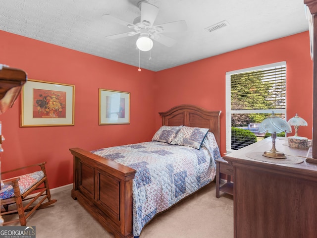 2866 Rosecommons Dr, Hampton, GA 30228 - bedroom featuring light colored carpet and ceiling fan