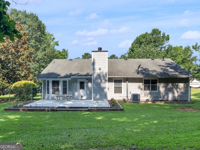 2866 Rosecommons Dr, Hampton, GA 30228 - back of house with a chimney and a patio