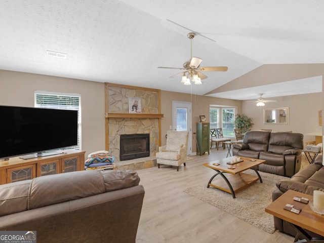 2866 Rosecommons Dr, Hampton, GA 30228 - living area featuring wood finished floors, ceiling fan, a fireplace, and lofted ceiling