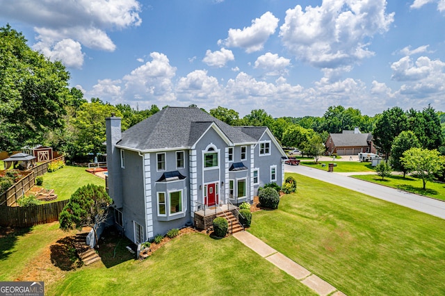 11 Chad Ct, Mcdonough, GA 30253 - view of front of house featuring a chimney, stucco siding, and a shingled roof