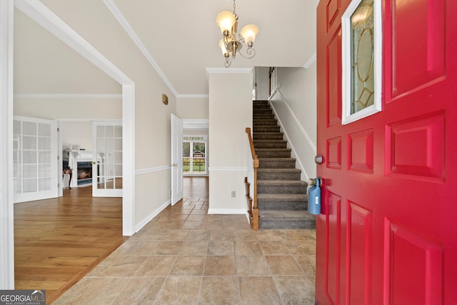 11 Chad Ct, Mcdonough, GA 30253 - foyer with stairway, ornamental molding, and a chandelier