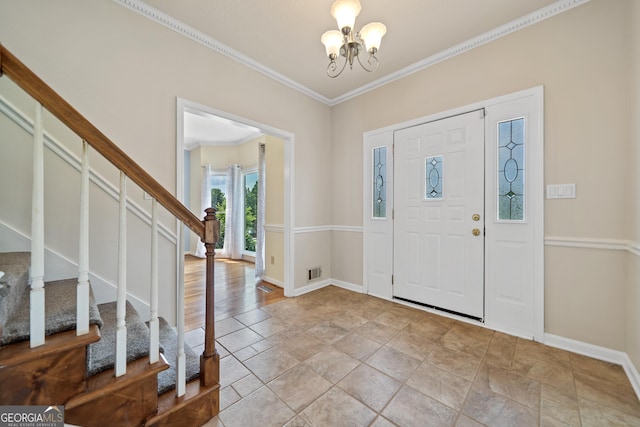 11 Chad Ct, Mcdonough, GA 30253 - entrance foyer with stairway, a chandelier, ornamental molding, and light stone finish flooring