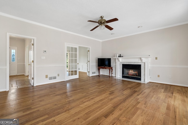 11 Chad Ct, Mcdonough, GA 30253 - unfurnished living room featuring a ceiling fan, wood finished floors, crown molding, a fireplace, and french doors