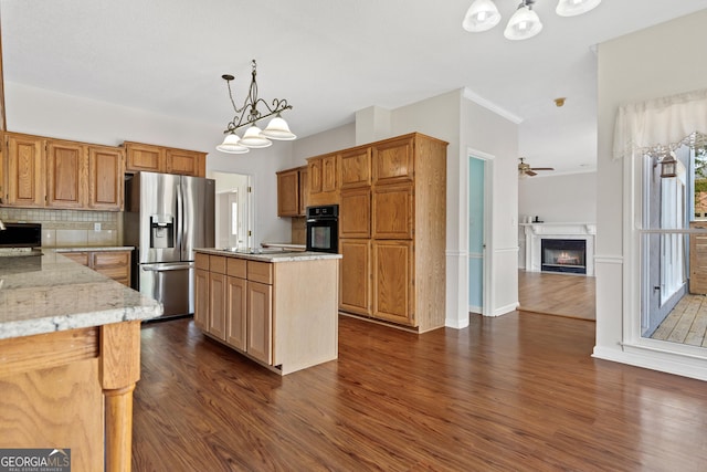 11 Chad Ct, Mcdonough, GA 30253 - kitchen with stainless steel fridge with ice dispenser, black oven, dark wood finished floors, a glass covered fireplace, and backsplash