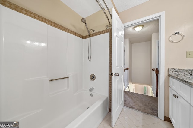 11 Chad Ct, Mcdonough, GA 30253 - full bathroom featuring a textured ceiling, vanity, tile patterned floors, and shower / washtub combination