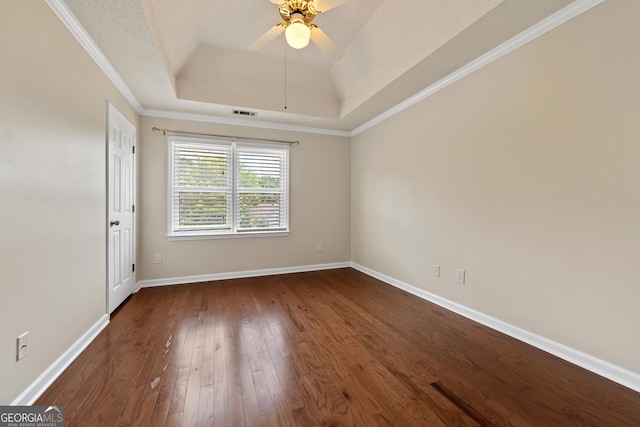 11 Chad Ct, Mcdonough, GA 30253 - unfurnished room with a raised ceiling, dark wood-type flooring, ceiling fan, and ornamental molding