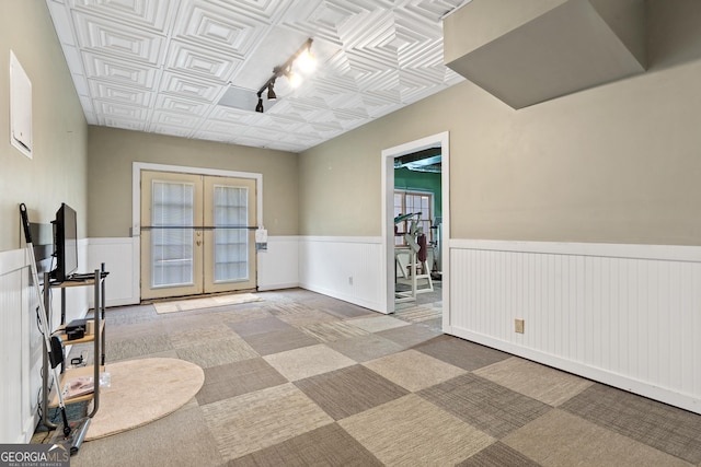 11 Chad Ct, Mcdonough, GA 30253 - carpeted empty room with french doors, wainscoting, and an ornate ceiling