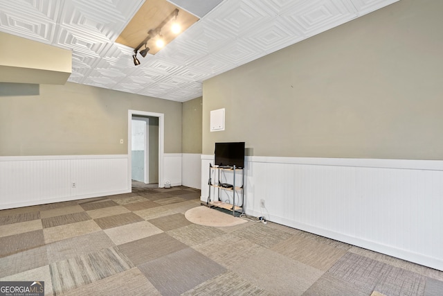 11 Chad Ct, Mcdonough, GA 30253 - carpeted empty room with wainscoting, an ornate ceiling, and track lighting