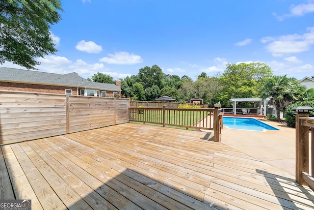11 Chad Ct, Mcdonough, GA 30253 - wooden terrace featuring a fenced backyard, a patio, and a storage shed