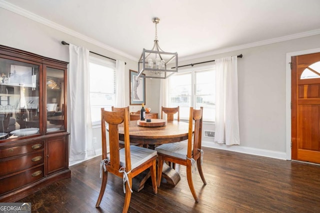 963 Turner Dr SE, Smyrna, GA 30080 - dining space with a chandelier, ornamental molding, and dark wood-style flooring