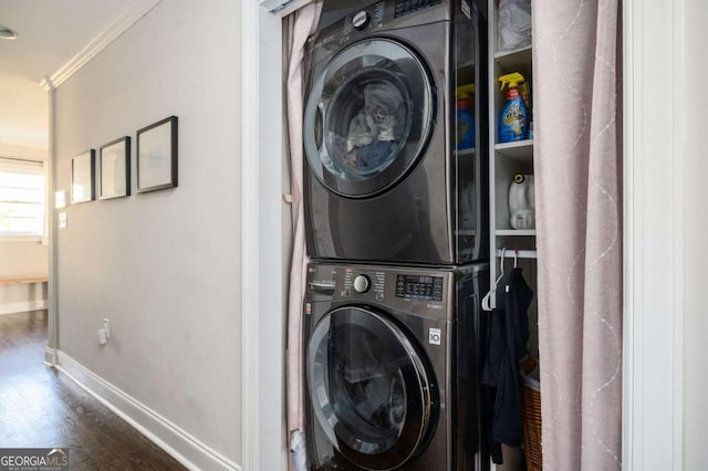 963 Turner Dr SE, Smyrna, GA 30080 - laundry room featuring stacked washer and clothes dryer, ornamental molding, and wood finished floors