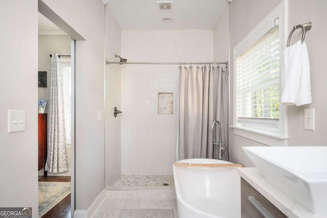 963 Turner Dr SE, Smyrna, GA 30080 - bathroom with a shower with shower curtain, a freestanding tub, and vanity